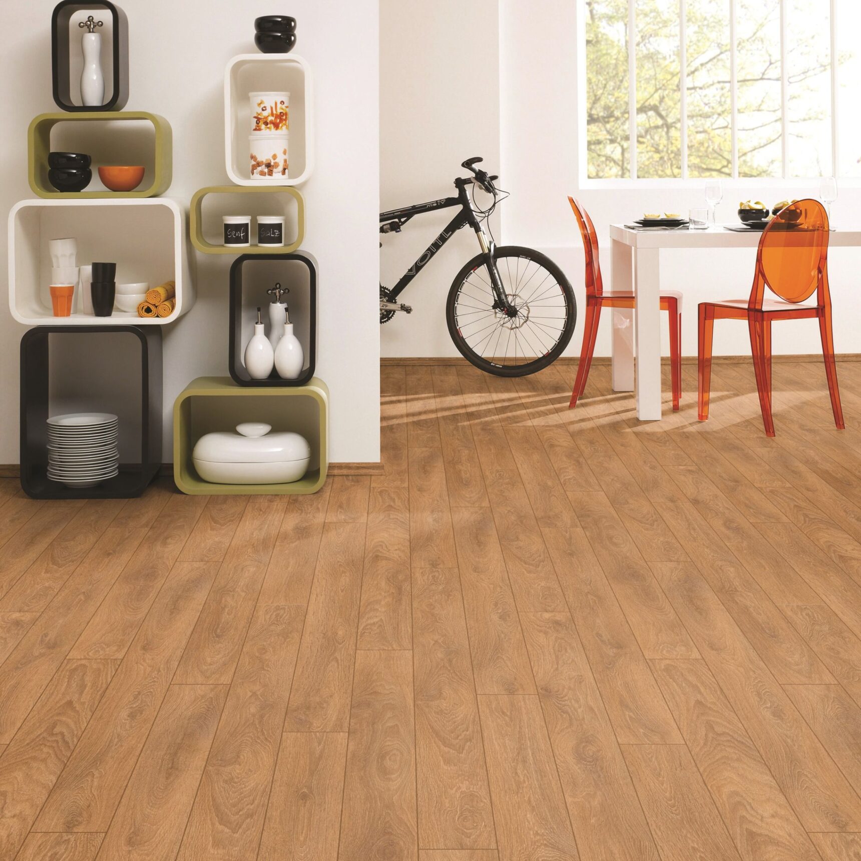 In situ image of Harlech Oak laminate flooring in a modern open plan living and dining room