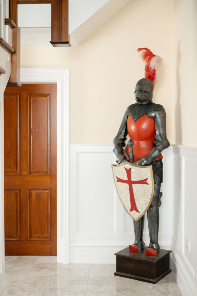 Grand interiors of a home with a Knight statue and SAM Victorian skirting board and architrave
